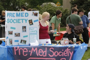 Photo of Pre-Med Society with their table and poster