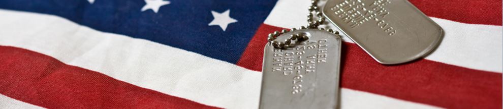 a picture of the United States Flag with dog tags remembering those who have given their lives while serving in the armed forces of the United States.