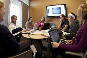 Students working together in a study room inside the library photo