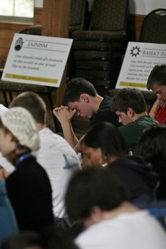 Students praying and participating at a rally