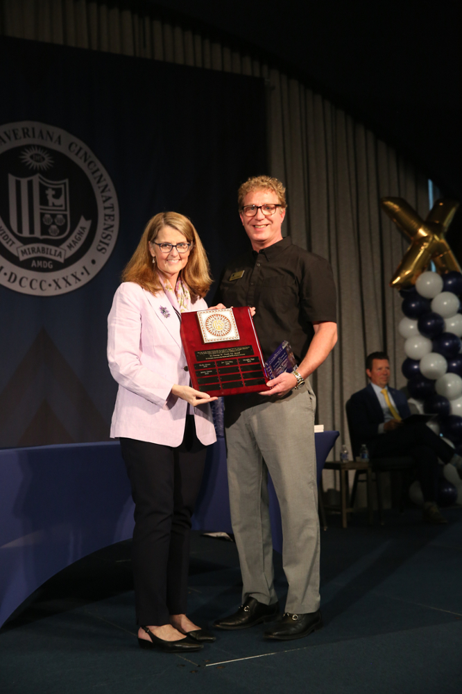 Photo of James Green receiving the award with President Hanycz