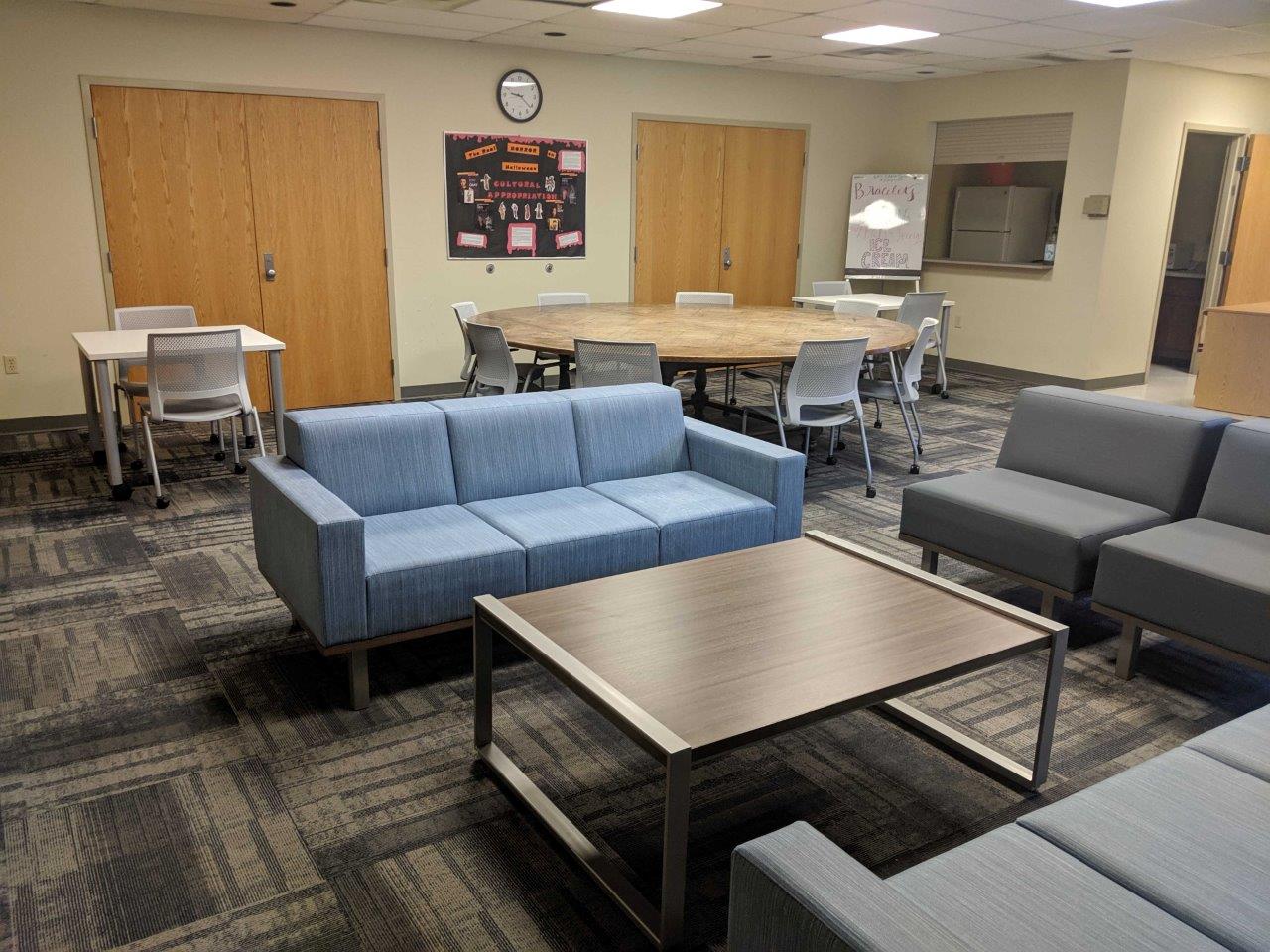 Village Apartments complex lounge, with community seating 