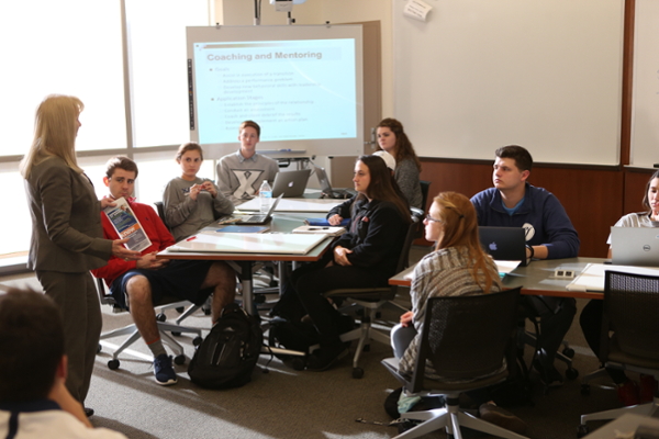 Photo of Professor Teaching and Leading a Lecture for her Students