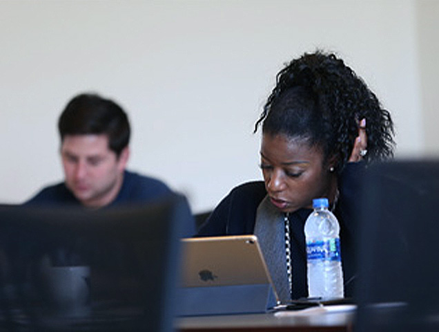 Accounting major working on a laptop in a classroom