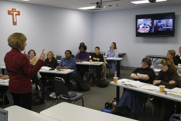 Professor lecturing students in a classroom