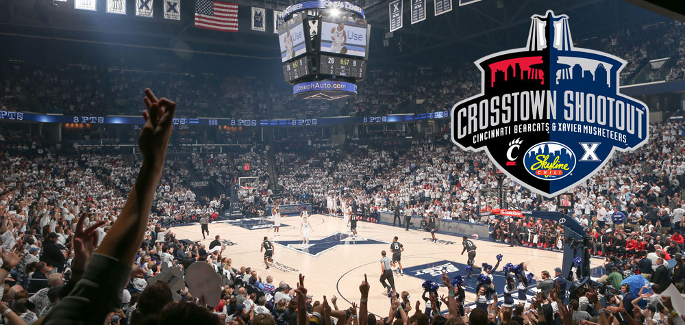 A photo from the crowds at Xavier University Cintas Center Arena during a Crosstown Shootout Game. Crosstown Shootout logo, Cincinnati Bearcats and Xavier Musketeers with University of Cincinnati logo and Xavier logo and Skyline Chili logo.