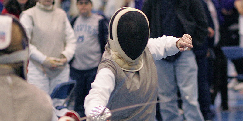 Xavier student in the middle of a fencing match