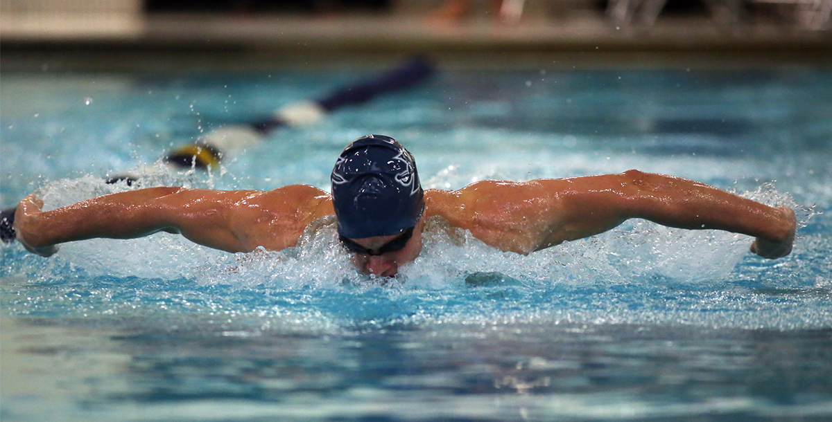 Xavier student swimming in the recreation center pool