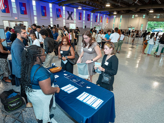 Students lining up to get orientation information