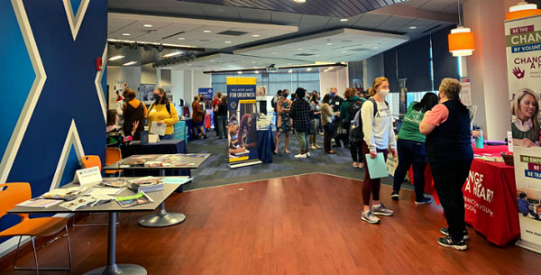 Tables with information in Arrupe lounge in Gallagher