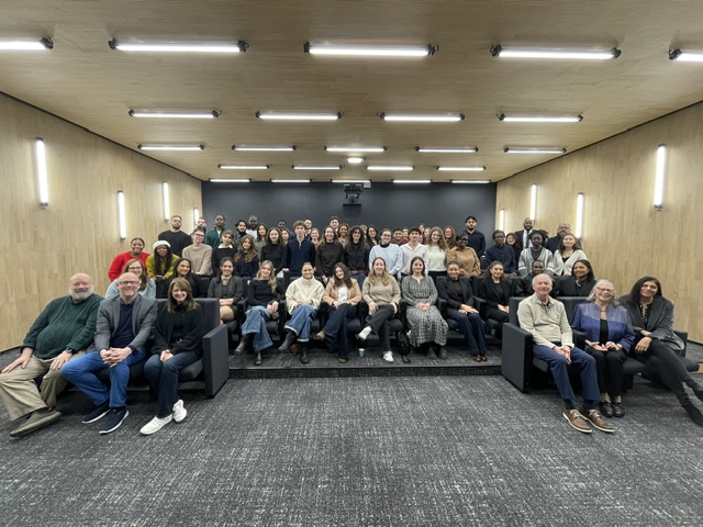 Members of Institute of Business Ethics sitting in auditorium 