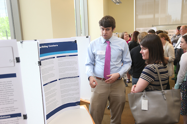 Student talking about project to guest