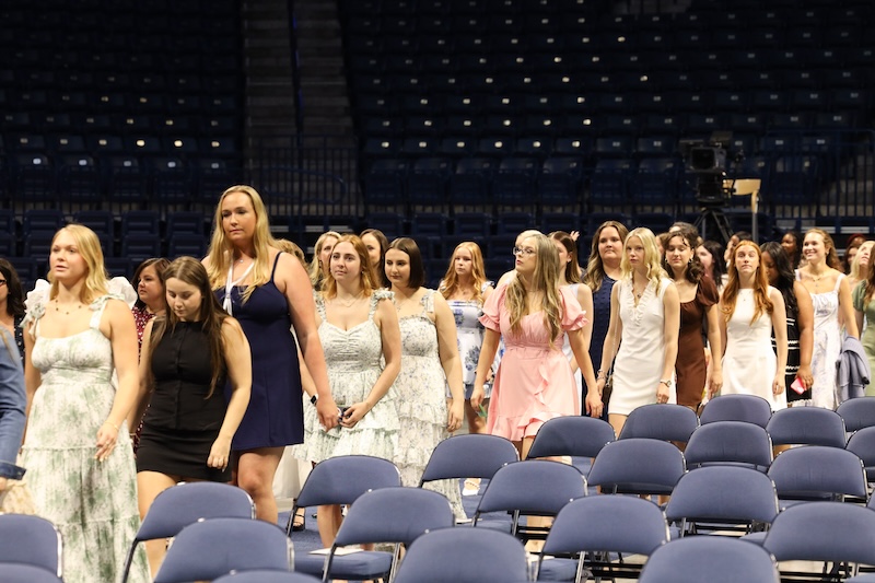 Students walking to their seats in the Nursing Pinning Ceremony