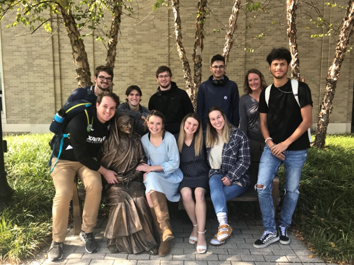 Marketing Students taking a Group photo with Mother Teresa statue