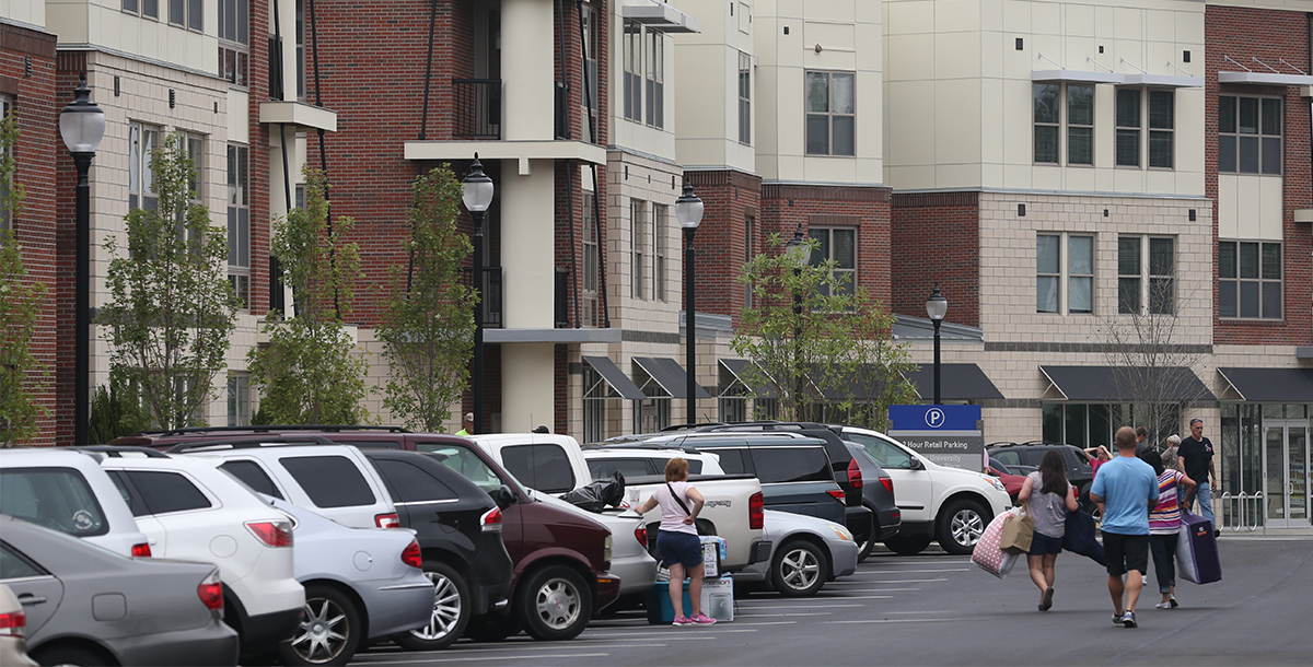 Cars parked along the University Station Apartments