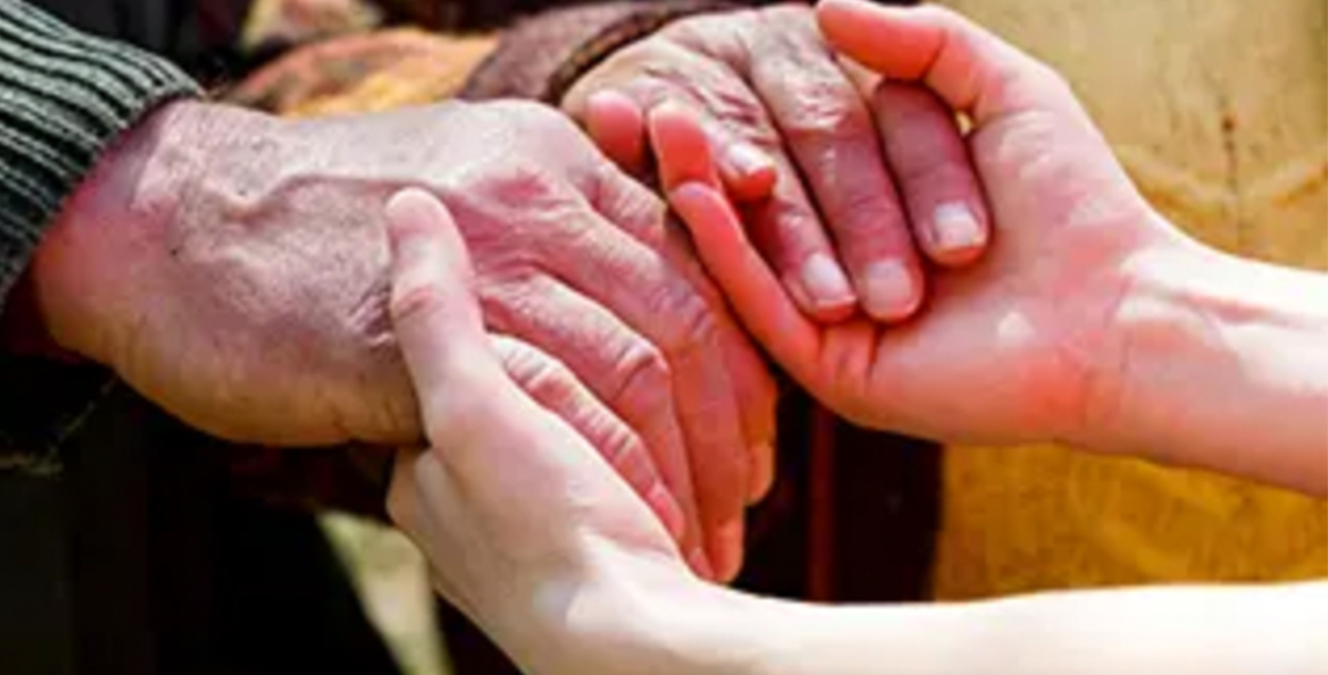 Two people holding hands