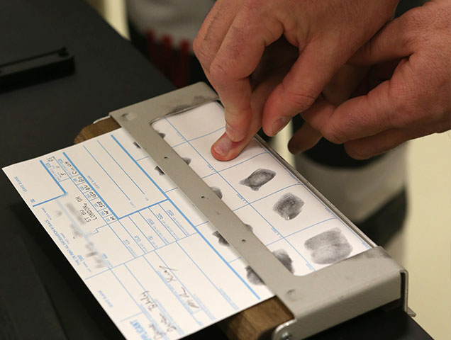 Criminal justice major learning to fingerprint