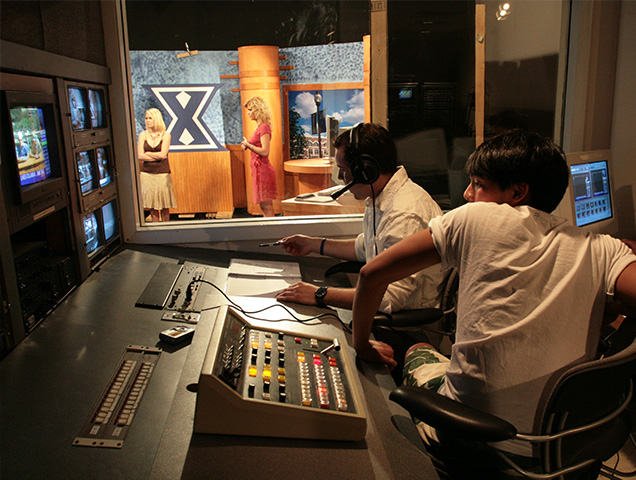 Students in the television studio production booth
