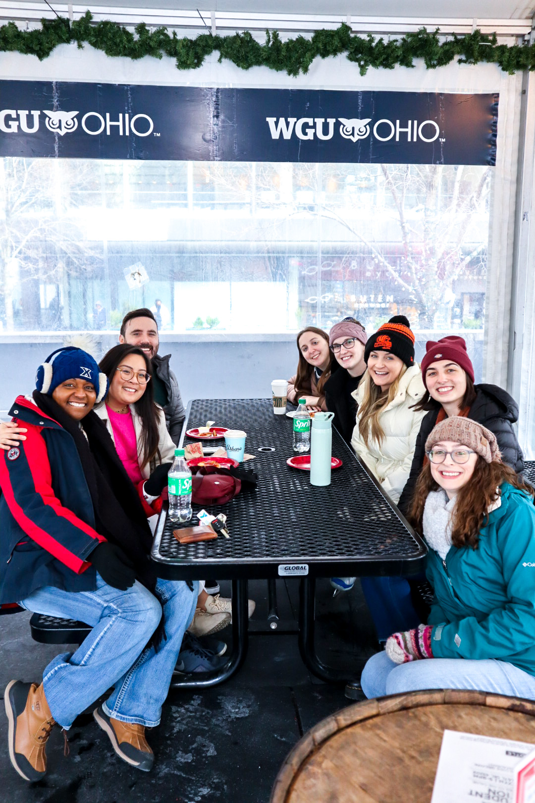 Graduate students at a table at Fountain Square