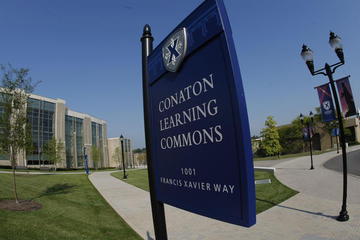 Conaton Learning Commons sign with building in background