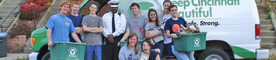 Photo of XU Students in front of a Car that reads 'Keep Cincinnati Beautiful'