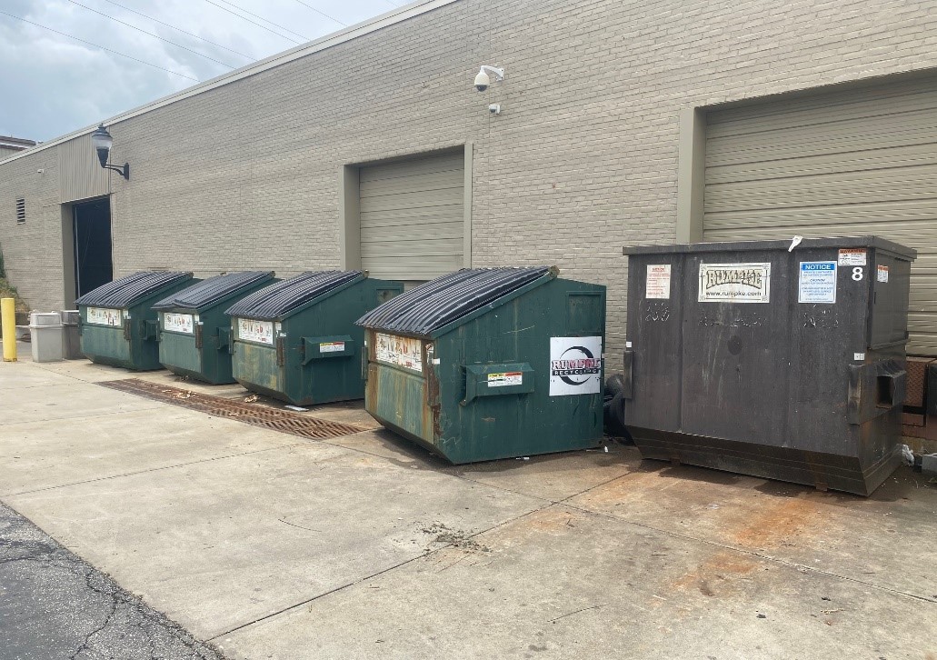 Photo of Recycling Bins lined up outside a building