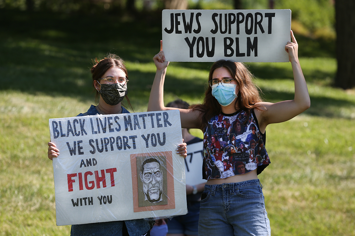 Photo of XU Students holding up BLM signs