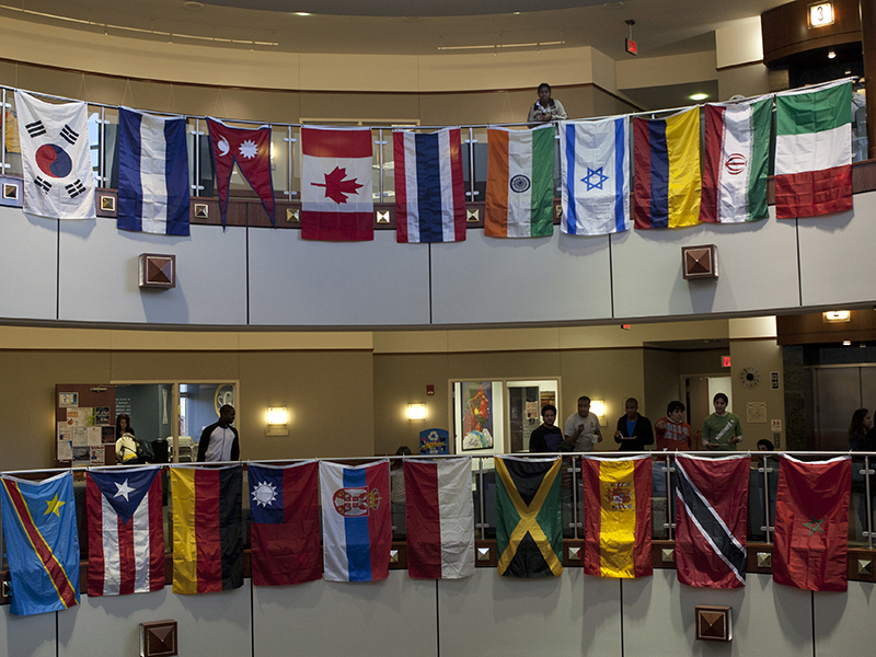 20 various international flags hang in the Gallagher Student Center. There are two rows of ten flags.