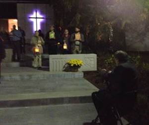 People praying for the Martyrs of the University