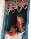 Mother and a child look out a window