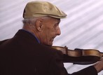 An older man with a violin