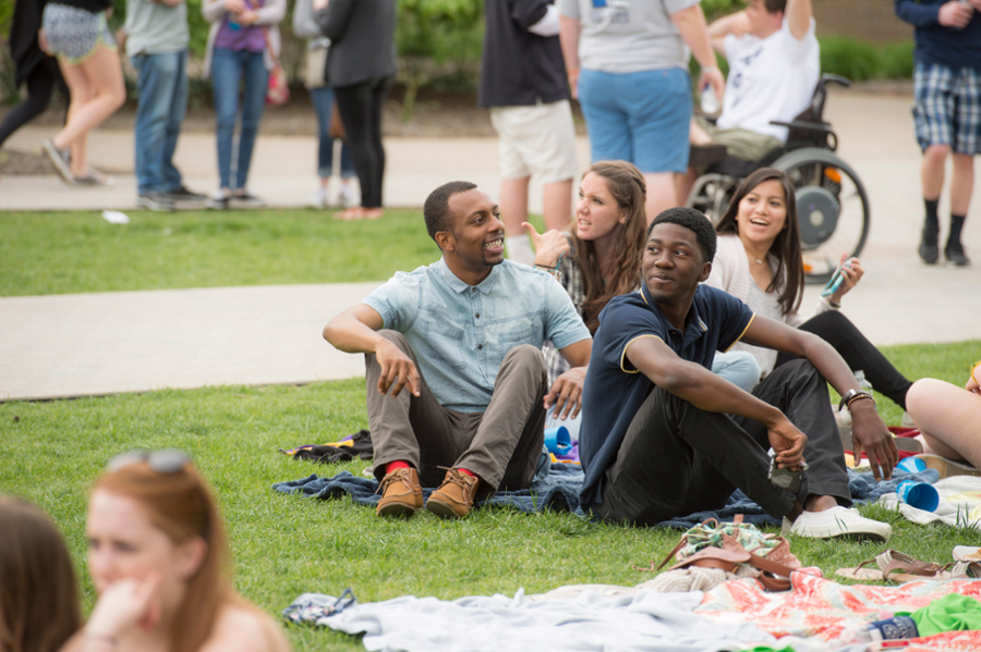 Xavier students sitting on yard