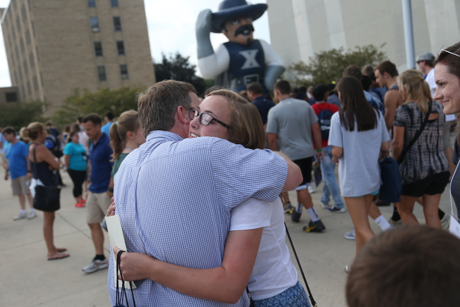 Xavier student hugging parent