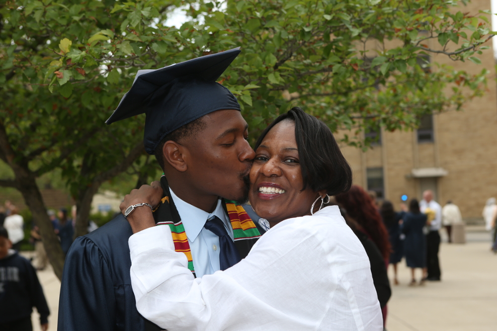 Xavier graduate with mother