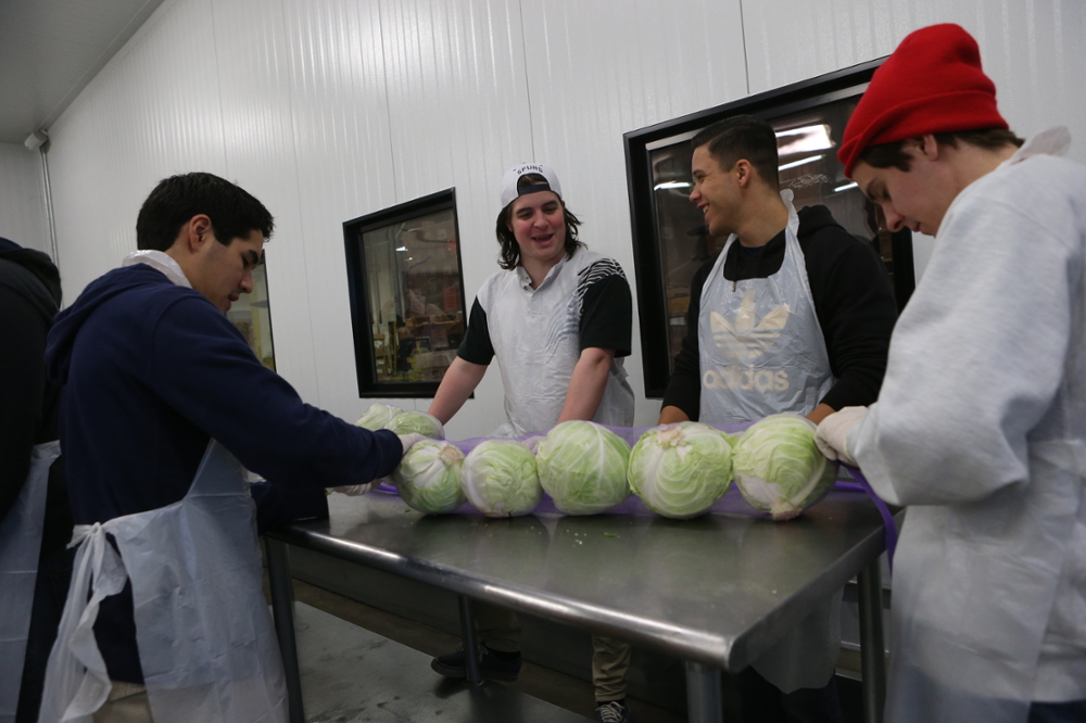 Xavier students working in a kitchen