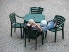 Person sitting at a table alone