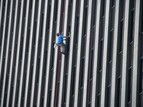 Person climbing side of a building