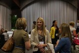 Three people talking at a social event