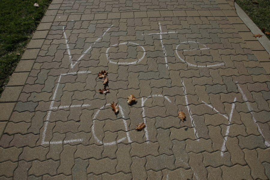 "Vote Early" written on sidewalk