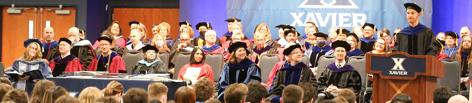 Professor giving a speech for honors day invocations at Xavier University