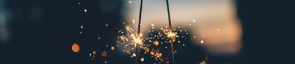 two lighted sparklers