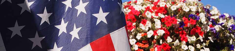 American Flag next to Flowers