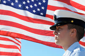 Soldier in front of American flag