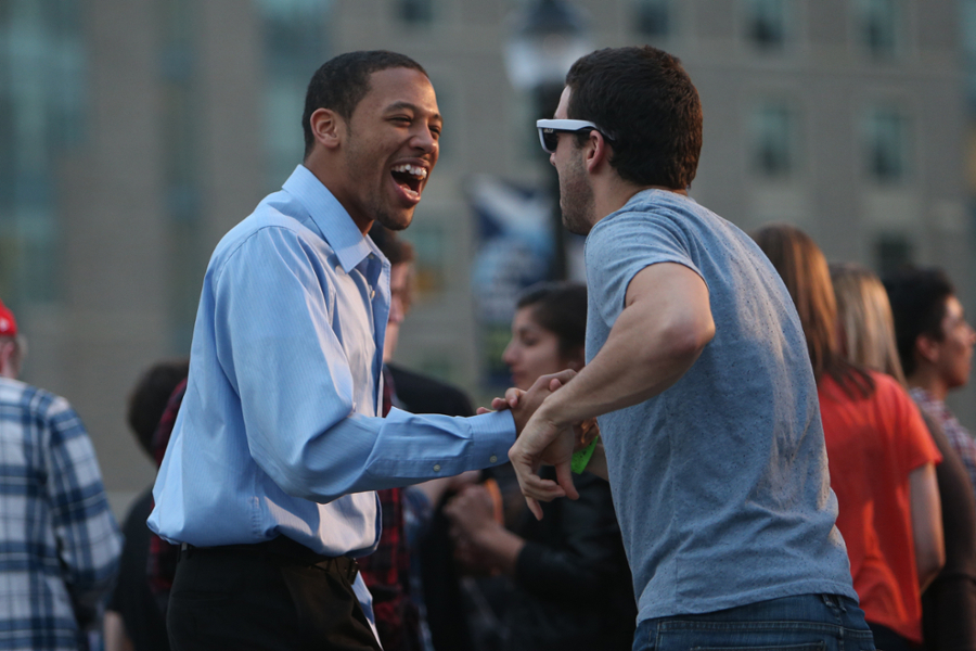 Two xavier students shaking hands