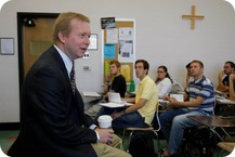 Professor teaching to students in a classroom