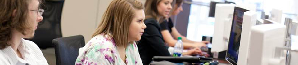 students in a classroom learning online and using accessibility resources