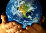 World being held in someone's hands