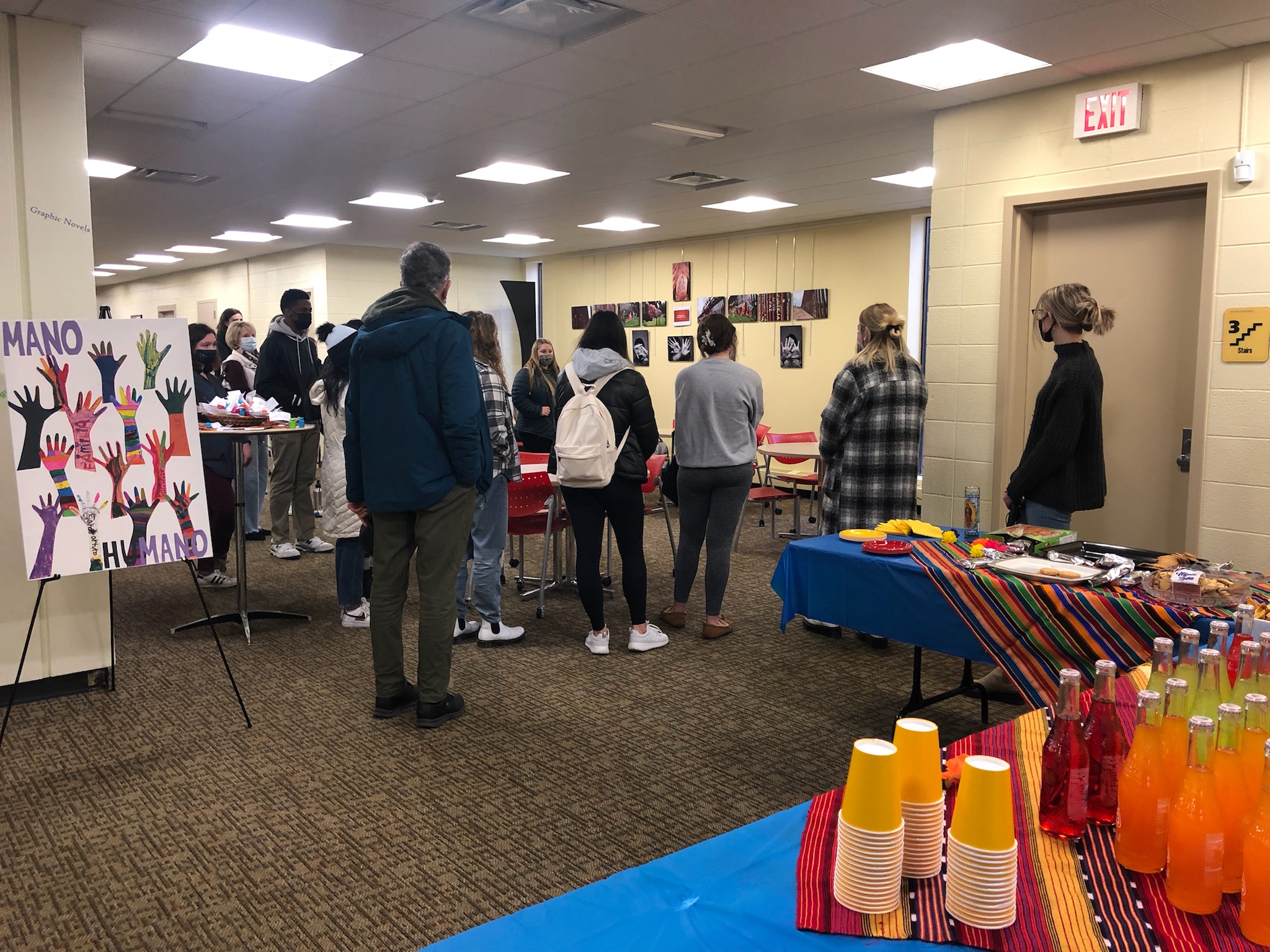 Families at the Border event, people looking at exhibit