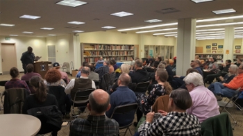 Poet reading to an audience