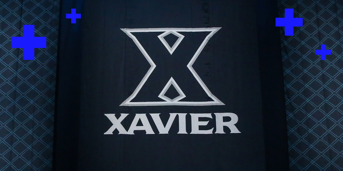 The Xavier logo on a blue pattern